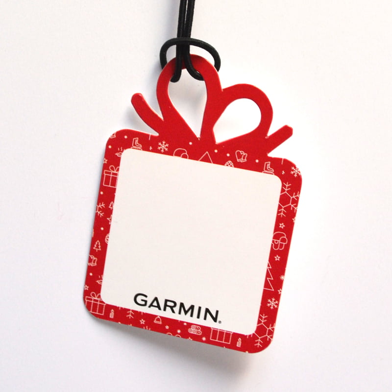 Custom swing tags tailored for unique brand identity, showcasing intricate designs and lamination finishes, equipped with durable eyelets for hanging on clothing and retail products, reflecting personalised branding and pricing strategies.