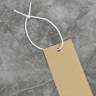 swing tag with attached and tied string
