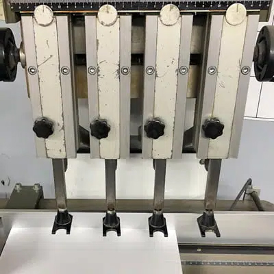 Machine used for drilling holes in paper