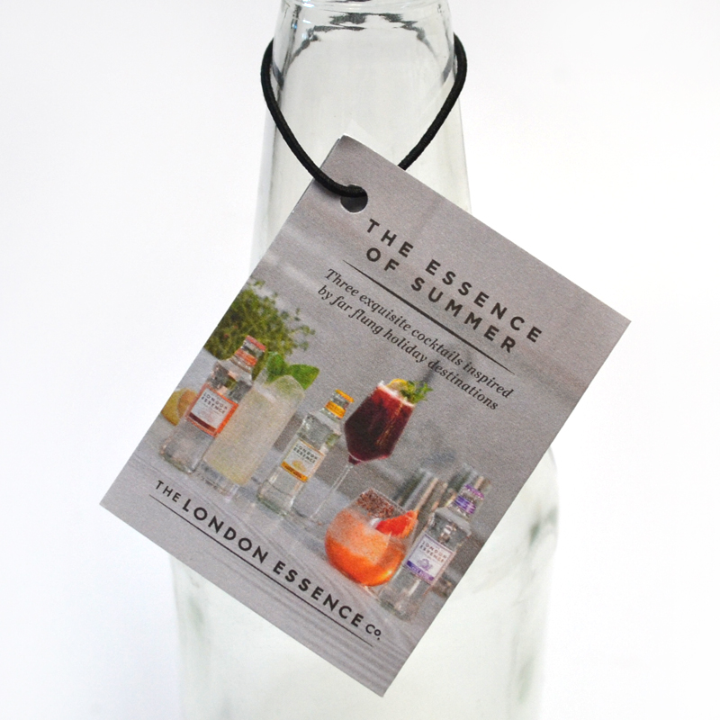 Bottle neck tags designed to wrap elegantly around beverage bottles, showcasing unique branding and product information, equipped with a secure hole for snug fitting, ideal for enhancing visual appeal and providing essential details in retail and promotional settings