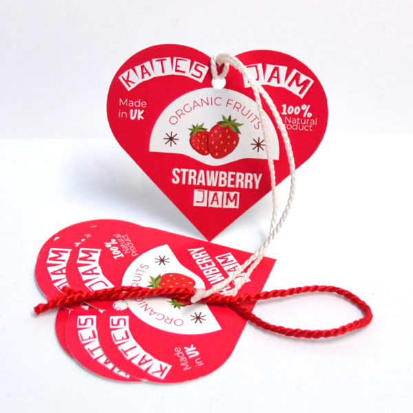 Silk hang tags with elegant lamination, showcasing sophisticated branding and design, complete with eyelets for secure attachment, emphasizing luxury and quality in retail clothing labels and product tags.